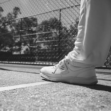 Cricket shoes with rubber spikes